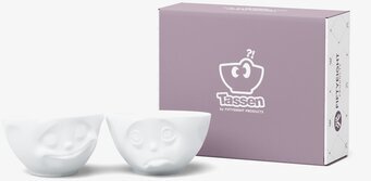 Bild av två vita porslinsskålar med ansiktsuttryck