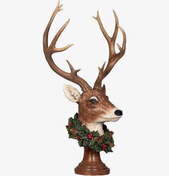 Bild av elegant hjortskulptur med naturinspirerad krans