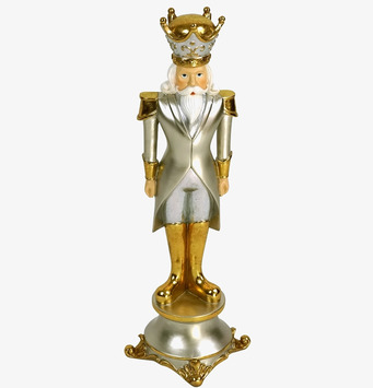 Bild av elegant nötknäppare i silver och guld detaljer