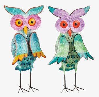 Bild av dekorativa ugglor i färgglada mönster och plåt