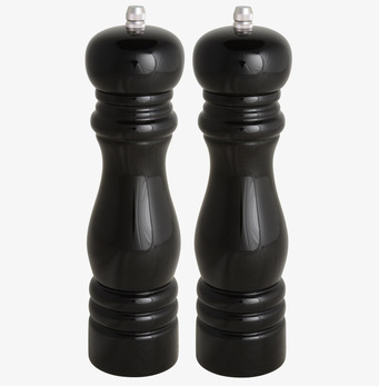 Bild av stilrena salt- och pepparkvarnar i köksmiljö