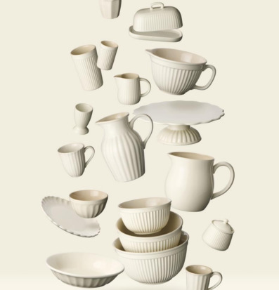 Bild av stilfullt arrangerade porslinsföremål i harmoni
