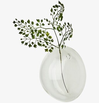 Foto av elegant väggvas med grön kvist för inredning