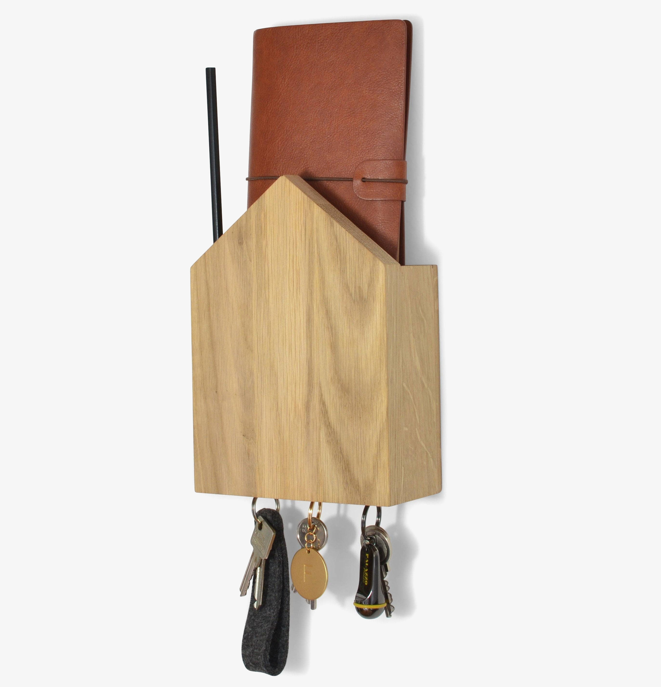 Bild av elegant och funktionellt nyckelhus i oljad ek