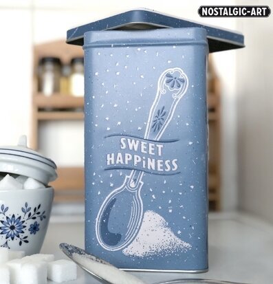 Bild av stilfull blå plåtburk med socker-tema i kök