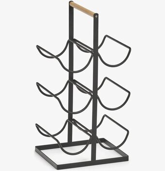 Bild av stilrent vinställ i svart och naturnära toner