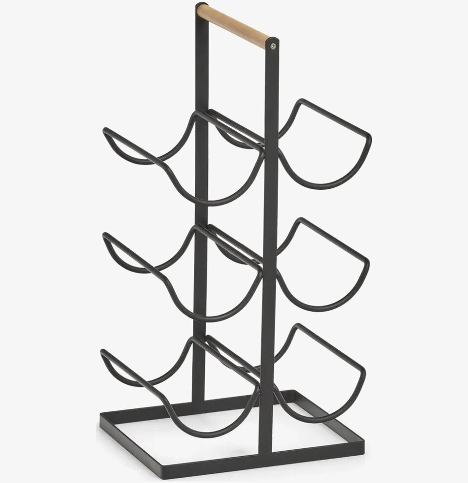 Bild av stilrent vinställ i svart och naturnära toner