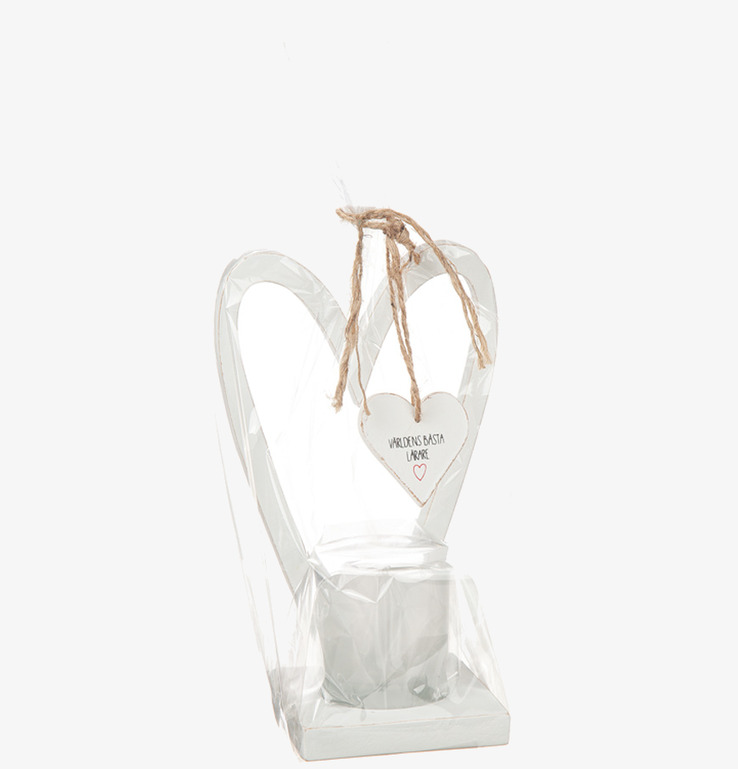 Bild av dekorativ vit ljushållare med hjärtformad design