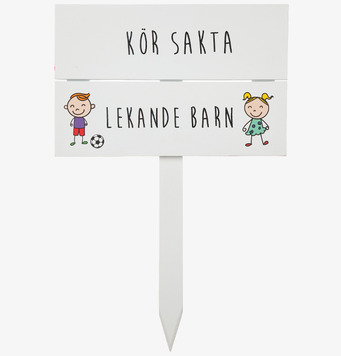 Foto av skylt: Kör Sakta - Lekande Barn, säkerhet först