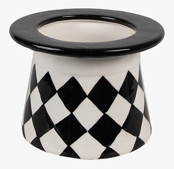 Bild av porslinsburk med harlekinmönster och elegant design