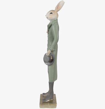 Bild av elegant kaninfigur i beige och grön klädsel