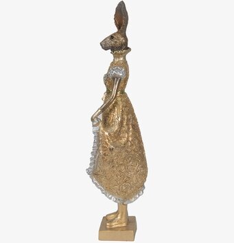 Bild av elegant kaninfigur i guld med detaljerad klänning