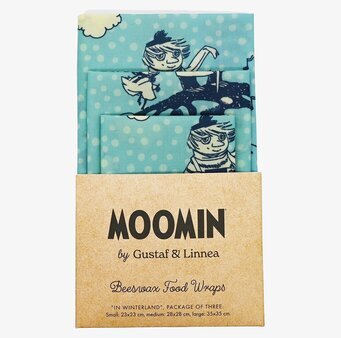 Bild av bivaxdukar med Mumin-tema i vinterlandskap