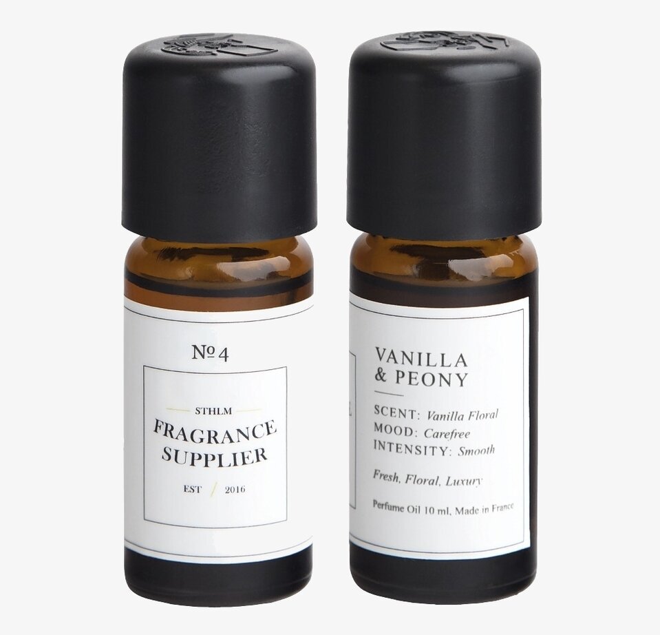 Bild av två eleganta doftoljor i bruna glasflaskor