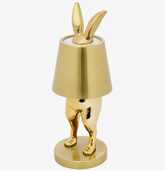 Foto av unik bordslampa med kaninform och gyllene skärm