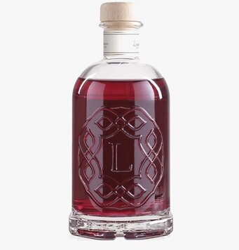 Bild av elegant flaska med doftpinnar och lyxig design