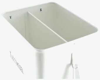 Foto av stilren vit plåtburk för tvättmedelsförvaring