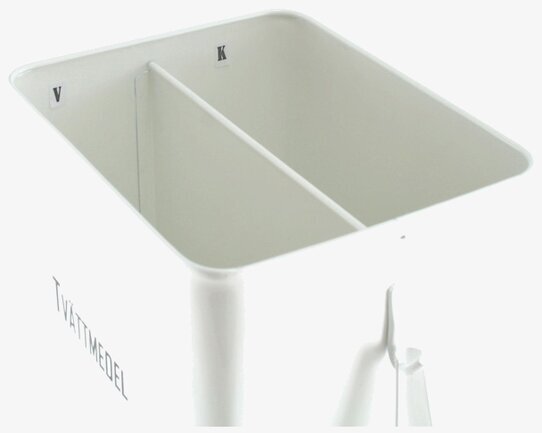 Foto av stilren vit plåtburk för tvättmedelsförvaring