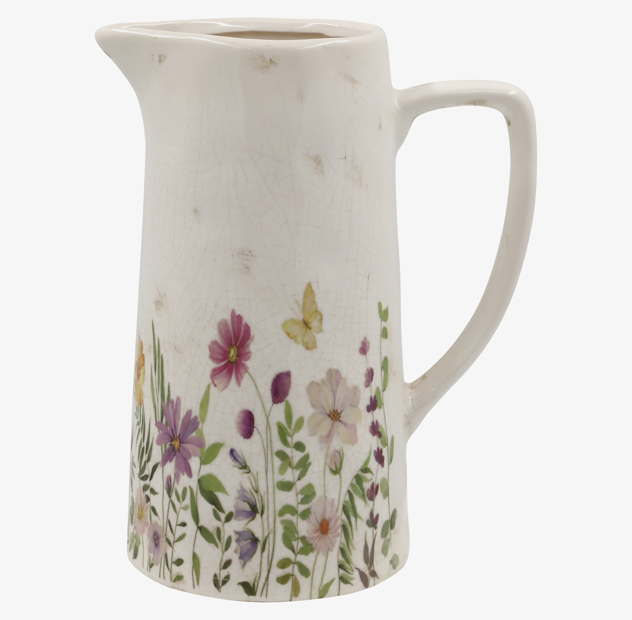 Bild av kanna med blomsterdetaljer och vintage-känsla