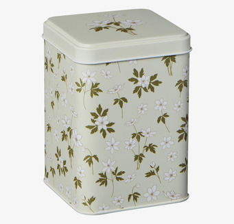 Bild av charmfull plåtburk med blommönster och nostalgi