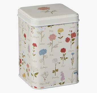 Bild av stilfull plåtburk med blomdesign och funktionalitet