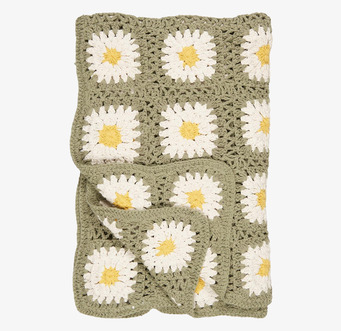 Bild av virkad pläd med blommönster i grönt och gult