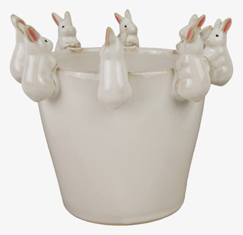 Bild av vit kruka med kaninfigurer och glansig finish
