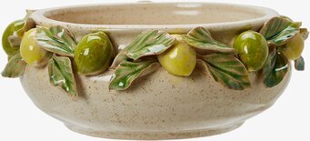 Foto av dekorativ planteringsskål i keramik och citroner