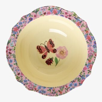 Bild av färgglad skål med blommor och fjärilsmotiv