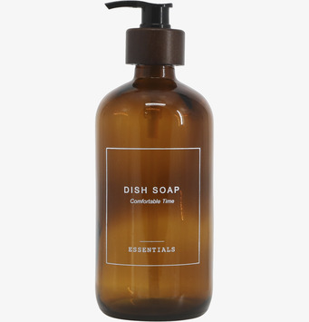 Bild av elegant brun glasflaska med pump för diskmedel