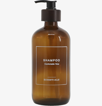 Bild av elegant brun glasflaska med svart pumpdesign