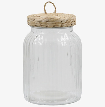 Bild av glasburk med flätat lock och elegant design