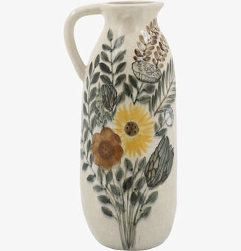 Bild av kanna med blomstermotiv och elegant design