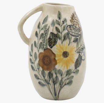 Foto av kanna med blomstermotiv och vintagekänsla