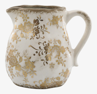 Bild av kanna med vintage design och gyllene detaljer