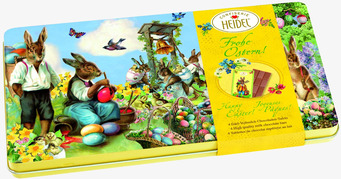 Bild av idyllisk påskscen med kaniner och choklad