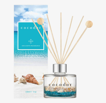 Bild av eleganta doftpinnar med strandinspirerad design