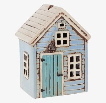 Bild av en charmig ljuslykta formad som ett hus