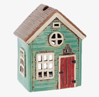 Bild av ljuslykta formad som ett charmigt litet hus