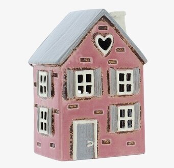 Bild av en rosa ljuslykta i form av ett charmigt hus