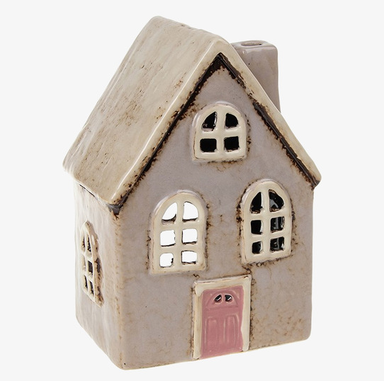 Foto av dekorativ ljuslykta formad som ett litet hus