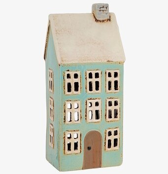 Bild av ljuslykta i form av ett högt och smalt hus