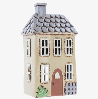 Bild av charmig ljuslykta i form av ett litet hus