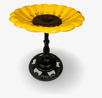 Bild av fågelbad med gul blomstruktur och svart stativ