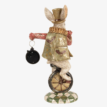 Foto av en kaninfigur på enhjuling i elegant kostym