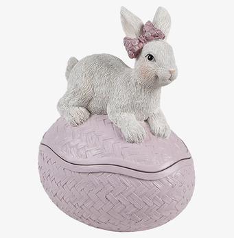 Bild av dekorativt rosa påskägg med kanin och rosett