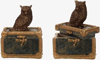 Bild av elegant skrin med uggla och dekorativa detaljer