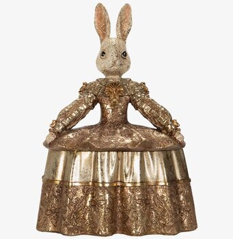 Foto av dekorativt kaninskrin med guldfärgad dräkt