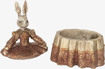 Bild av dekorativ kaninskulptur och ornamenterat skrin