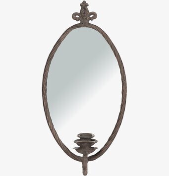 Bild av ljuslampett med spegel och tvinnad metallram